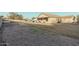 Large backyard with covered patio and gravel landscaping at 6910 S 26Th Ln, Phoenix, AZ 85041