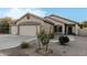 Two-car garage and front yard landscaping at 6910 S 26Th Ln, Phoenix, AZ 85041