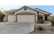 Two-car garage and front yard landscaping at 6910 S 26Th Ln, Phoenix, AZ 85041