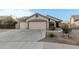 House exterior with a two-car garage and driveway at 6910 S 26Th Ln, Phoenix, AZ 85041