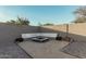 Relaxing firepit area with built-in seating at 6910 S 26Th Ln, Phoenix, AZ 85041