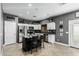 Eat-in kitchen with island, white cabinets, and pantry at 6910 S 26Th Ln, Phoenix, AZ 85041