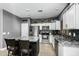 Modern kitchen with stainless steel appliances and granite countertops at 6910 S 26Th Ln, Phoenix, AZ 85041