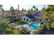 Aerial view showing home's backyard oasis, pool, and play area at 7489 E Windrose Dr, Scottsdale, AZ 85260