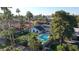 Aerial view of a remodeled home with pool and lush landscaping at 7489 E Windrose Dr, Scottsdale, AZ 85260