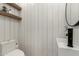 Small modern bathroom with white shiplap walls and floating vanity at 7489 E Windrose Dr, Scottsdale, AZ 85260