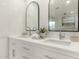 Clean bathroom with double sinks and white cabinets at 7489 E Windrose Dr, Scottsdale, AZ 85260