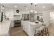 Modern kitchen with white cabinets, stainless steel appliances, and an island at 7489 E Windrose Dr, Scottsdale, AZ 85260