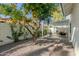 Outdoor patio area with a pergola and citrus tree at 7489 E Windrose Dr, Scottsdale, AZ 85260