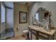 Elegant bathroom with a large mirror, vanity, and walk-in shower at 7546 E High Point Dr, Scottsdale, AZ 85266