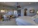 Elegant bedroom with access to another room and natural light at 7546 E High Point Dr, Scottsdale, AZ 85266