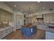 Gourmet kitchen with custom cabinetry, a large island, and high-end appliances at 7546 E High Point Dr, Scottsdale, AZ 85266