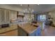 Gourmet kitchen boasts a large island and custom cabinetry at 7546 E High Point Dr, Scottsdale, AZ 85266