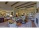 Elegant living room featuring a comfortable seating area and hardwood floors at 7546 E High Point Dr, Scottsdale, AZ 85266