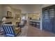 Relaxing living area with a view into the kitchen at 7546 E High Point Dr, Scottsdale, AZ 85266