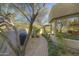 Landscaped pathway leading to the home's entrance at 7546 E High Point Dr, Scottsdale, AZ 85266