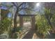 Brick pathway surrounded by desert plants leading to the house at 7546 E High Point Dr, Scottsdale, AZ 85266