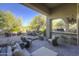 Spacious patio featuring comfortable seating, a grill, and desert landscaping at 7546 E High Point Dr, Scottsdale, AZ 85266