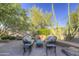 Relaxing patio with wicker furniture, perfect for outdoor entertaining at 7546 E High Point Dr, Scottsdale, AZ 85266