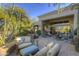 Peaceful patio with comfortable seating and a built-in grill at 7546 E High Point Dr, Scottsdale, AZ 85266