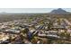 Aerial view of community featuring numerous homes, lush landscaping, and a scenic mountain backdrop at 8443 E Bonita Dr, Scottsdale, AZ 85250