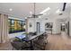 Bright dining room features a large window and modern dining table with seating for six at 8443 E Bonita Dr, Scottsdale, AZ 85250