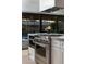 Modern kitchen features a large range and marble island at 8443 E Bonita Dr, Scottsdale, AZ 85250