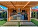 Outdoor kitchen with stainless steel appliances and a built-in grill at 8443 E Bonita Dr, Scottsdale, AZ 85250