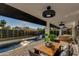 Patio with dining table and seating near the pool at 8443 E Bonita Dr, Scottsdale, AZ 85250