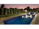 Luxury pool and spa with brick patio and landscape lighting at 8443 E Bonita Dr, Scottsdale, AZ 85250