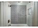 Updated shower with patterned tile and gold fixtures at 8443 E Bonita Dr, Scottsdale, AZ 85250