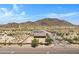 Aerial view of two houses in a desert landscape, near mountains at 8474 W Switchback Trl, Casa Grande, AZ 85194