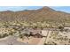 Aerial view of a single-story house in a desert setting at 8474 W Switchback Trl, Casa Grande, AZ 85194