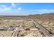 Aerial view of a house with a large lot in a desert landscape at 8474 W Switchback Trl, Casa Grande, AZ 85194