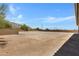 Large, flat backyard with desert landscaping at 8474 W Switchback Trl, Casa Grande, AZ 85194