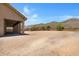 Home's back exterior with covered patio and view at 8474 W Switchback Trl, Casa Grande, AZ 85194