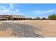 View of backyard with gravel and a home addition at 8474 W Switchback Trl, Casa Grande, AZ 85194