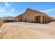 Home's back exterior with covered patio and view at 8474 W Switchback Trl, Casa Grande, AZ 85194