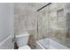 Bathroom with a shower/tub combo and tile surround at 8474 W Switchback Trl, Casa Grande, AZ 85194