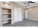 Bright bedroom with built-in shelves and sliding door closet at 8474 W Switchback Trl, Casa Grande, AZ 85194