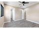 Bedroom with wood-look floors, ceiling fan and window at 8474 W Switchback Trl, Casa Grande, AZ 85194