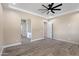 Primary bedroom with ceiling fan and en-suite bathroom access at 8474 W Switchback Trl, Casa Grande, AZ 85194