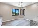 Bright dining area with large window and chandelier at 8474 W Switchback Trl, Casa Grande, AZ 85194