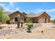 Gorgeous desert home with a three-car garage and mature landscaping at 8474 W Switchback Trl, Casa Grande, AZ 85194