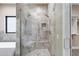 Large walk-in shower with glass enclosure and built-in seat at 8474 W Switchback Trl, Casa Grande, AZ 85194