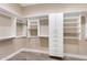 Large walk-in closet with white shelving and drawers at 8474 W Switchback Trl, Casa Grande, AZ 85194