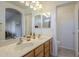 Double vanity bathroom with light-colored cabinets and tile floor at 896 E Windsor Dr, Gilbert, AZ 85296