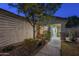 House exterior at night, showing a lighted entryway and landscaping at 896 E Windsor Dr, Gilbert, AZ 85296