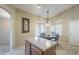 Bright kitchen nook with a table and chairs, plus an island at 896 E Windsor Dr, Gilbert, AZ 85296