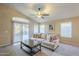 Living room with sliding doors to backyard and comfy couch at 896 E Windsor Dr, Gilbert, AZ 85296